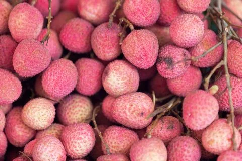 Stack of Lychees on a market stall Stock Photos