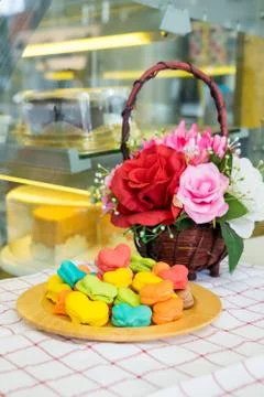 Stack of macaron heart shape dessert  on woodent plate Stock Photos