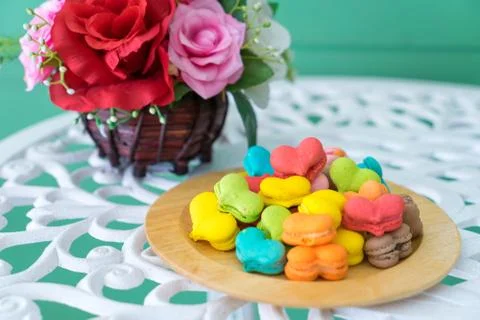 Stack of macaron heart shape dessert  on woodent plate Stock Photos