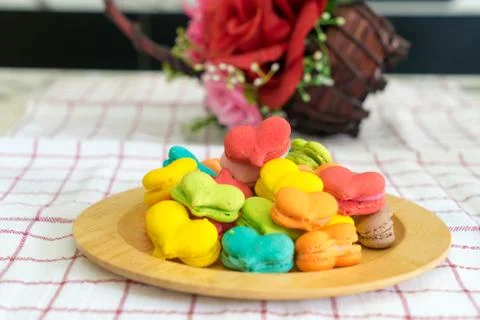 Stack of macaron heart shape dessert  on woodent plate Stock Photos