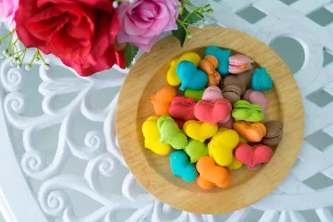 Stack of macaron heart shape dessert  on woodent plate Stock Photos