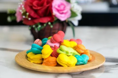 Stack of macaron heart shape dessert  on woodent plate Stock Photos
