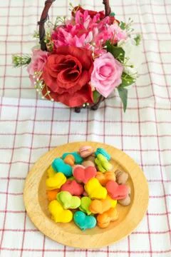 Stack of macaron heart shape dessert  on woodent plate Stock Photos