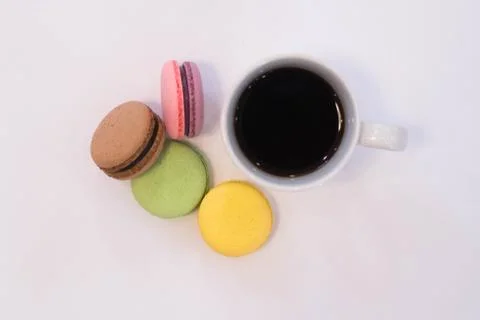 Stack of macarons with coffee cup. on white background. Stock Photos