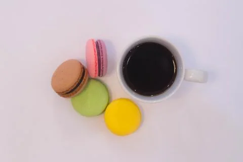 Stack of macarons with coffee cup. on white background. Stock Photos
