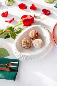 A stack of macarons. Spring composition of macarons with flowers. Stock Photos