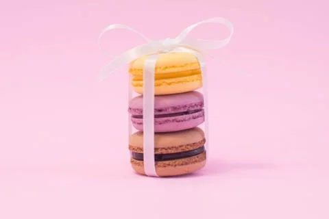 Stack of macarons on wooden plate. Stock Photos