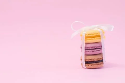 Stack of macarons on wooden plate. Stock Photos