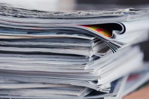 A stack of magazines, close-up macro filled the frame. A background for Fotos de archivo