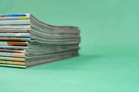 Stack magazines on green background Stock Photos