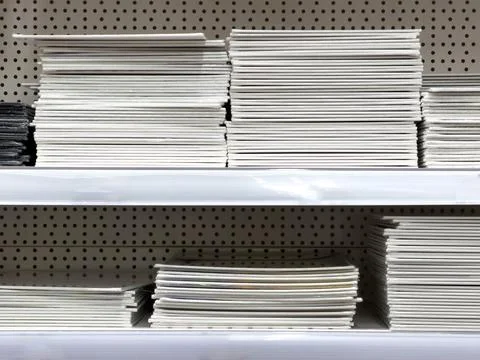 A stack of magazines on a shelf 스톡 사진