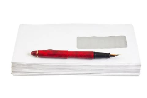 Stack of mail envelopes and a pen Stock Photos
