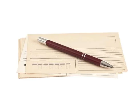 Stack of mail envelopes and a pen Stock Photos