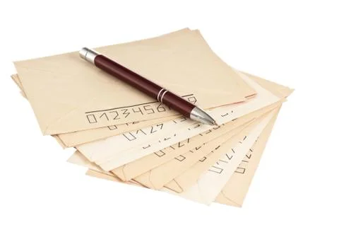 Stack of mail envelopes and a pen Stock Photos