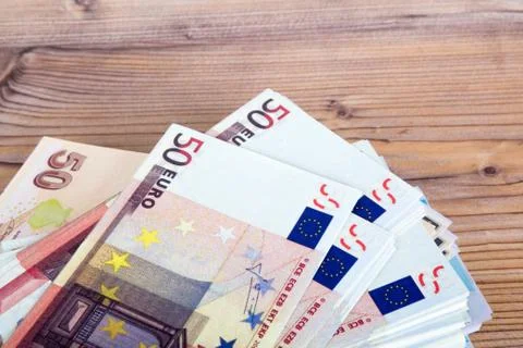Stack of Many Banknotes on Table Stock Photos