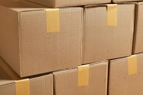 Stack of many cardboard boxes as background. Packaging goods Stock Photos