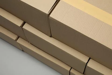 Stack of many closed cardboard boxes on light grey background, above view 写真素材
