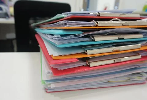 Stack of many color document folder on desk Stock Photos