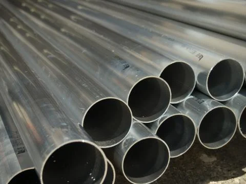 Stack of Many Pipes at the Construction Site Stock Photos