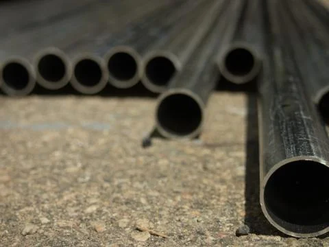 Stack of Many Pipes at the Construction Site Stock Photos