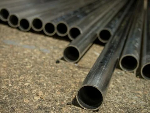 Stack of Many Pipes at the Construction Site Stock Photos