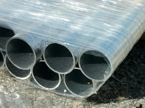 Stack of Many Pipes at the Construction Site Stock Photos