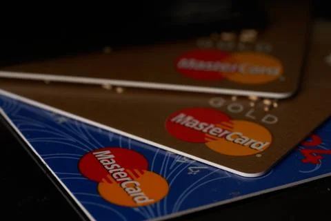 Stack of mastercard cards on black surface Stock Photos