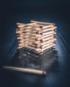 Stack of matches with a single match Stock Photos