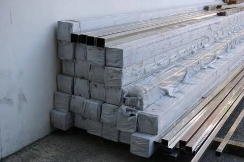 Stack of material metal square tube in warehouse Stock Photos