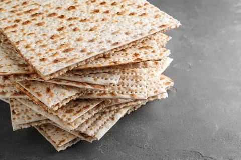 Stack of matzos on grey table, closeup 写真素材