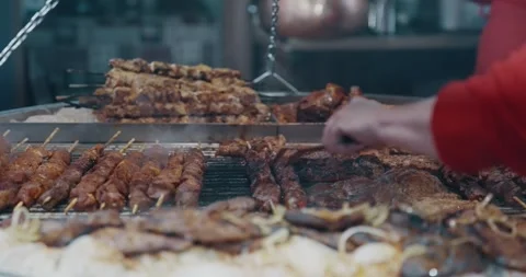 A stack of meat sausages wurst in Germany at Christmas market with a silver f Stock Footage 347162987
