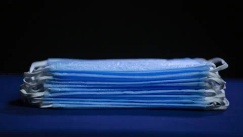 A stack of medical masks is consumed, stop motion Stock Footage 135691196
