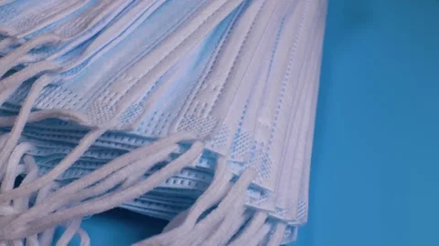 Stack of medical protective face masks rotates.  Stock Footage 228923273