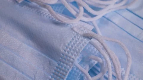 Stack of medical protective face masks rotates. The concept of protection  Stock Footage 228923380