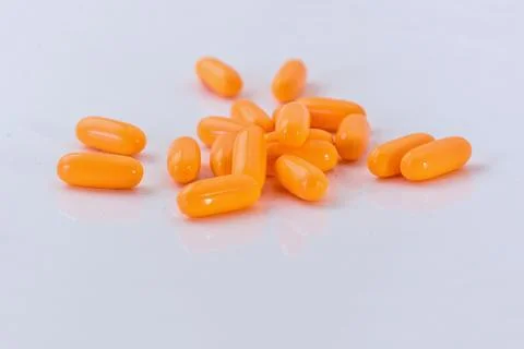 Stack of medication pills - orange Stock Photos