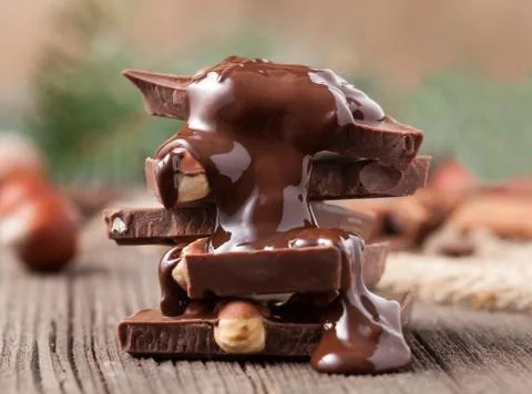 Stack of melted chocolate with nuts Stock Photos