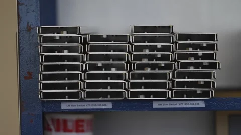A stack of metal boxes with a label that says "The best quality" Stock Footage 302456213