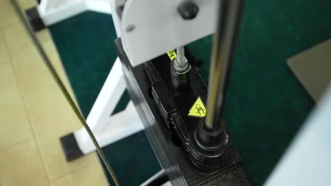 Stack of metal objects in the exercise machine moves up and down.  Stock Footage 152008183