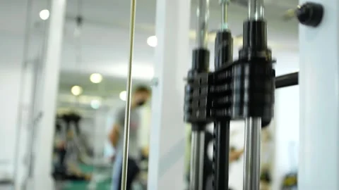 Stack of metal objects in the exercise machine moves up and down.  Stock Footage 152008189