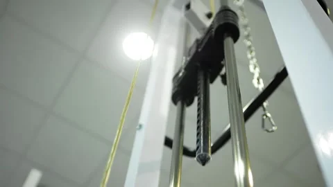 Stack of metal objects in the exercise machine moves up and down.  Stock Footage 152008204