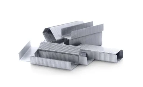 Stack of metal staples. Isolated on a white background. Stock Photos