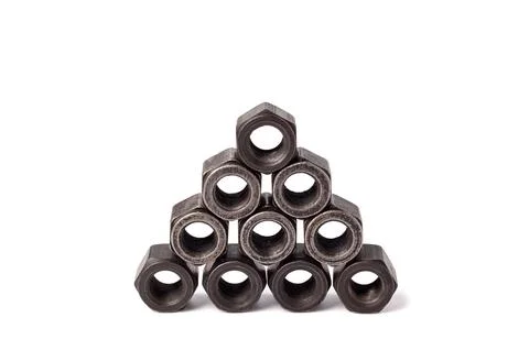 Stack of metallic nuts isolated on white background. Female screw nut with copy Stock Photos