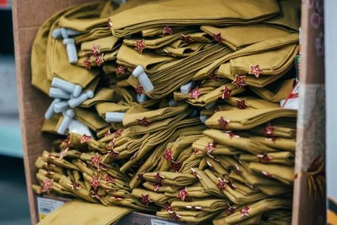 Stack of military caps of the Soviet army with red stars in supermarket Stock-Fotos