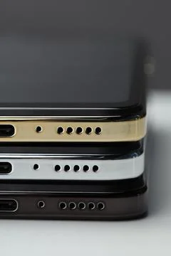 Stack of modern smartphones on white table, closeup 스톡 사진