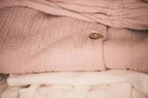 Stack of modern textile in room. Spring female clothes. Fashionable. Stock-Fotos