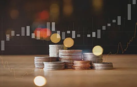 Stack of money coin with trading graph, financial investment concept Foto stock