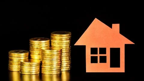Stack of money coins, the assessment of the condition of the property. Stock Photos
