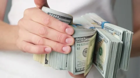 A stack of money in the hands of a man close-up, counting cash bills. Stock Footage 212659358