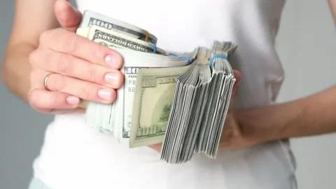 A stack of money in the hands of a man close-up Stock Footage 228699472