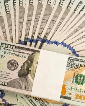 Stack of money in US dollars cash banknotes Stock Photos
